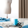 fabric, scissors, and thread