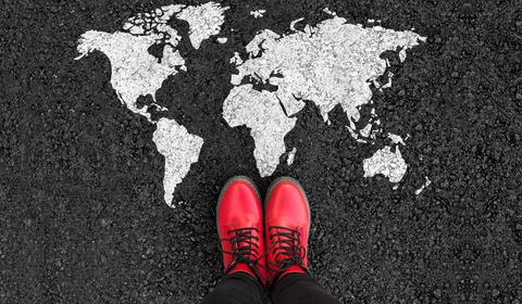 World map and woman in shoes
