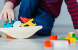 close up of kid playing toys