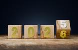 wood blocks that say 2025 with the 5 switching to a 6 to be 2026