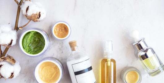 Natural skincare cosmetic products on white marble table